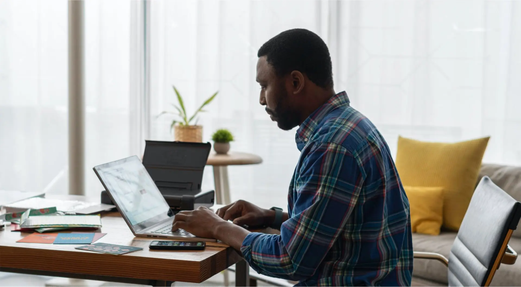 Man working on a laptop at a desk